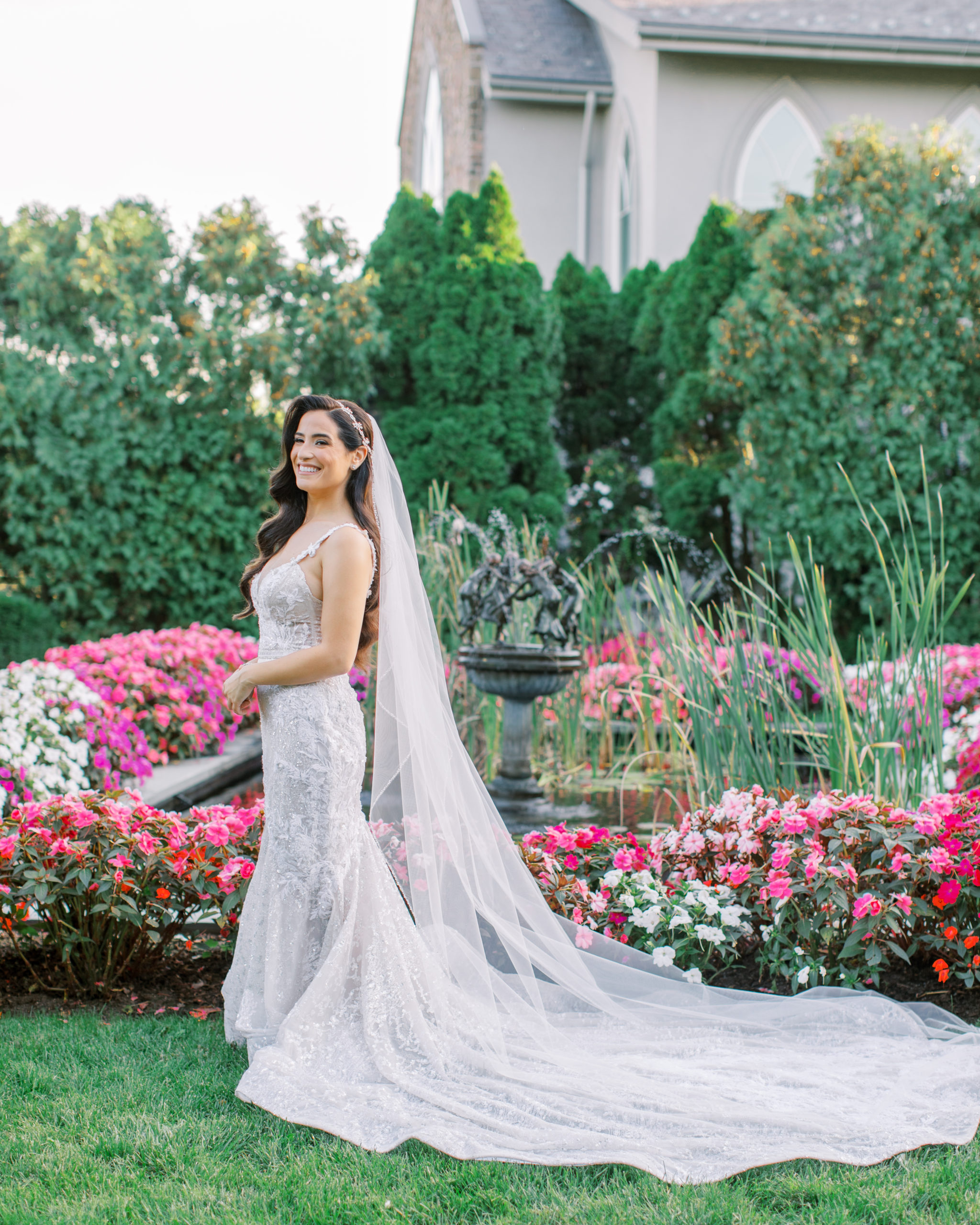 bride smiles in the garden at sunset wearing berta dress - Park Savoy Wedding Photography