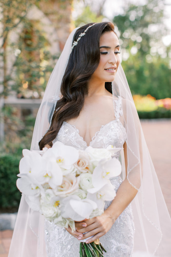 bride with long dark hair with her bouquet - Park Savoy Wedding Photography
