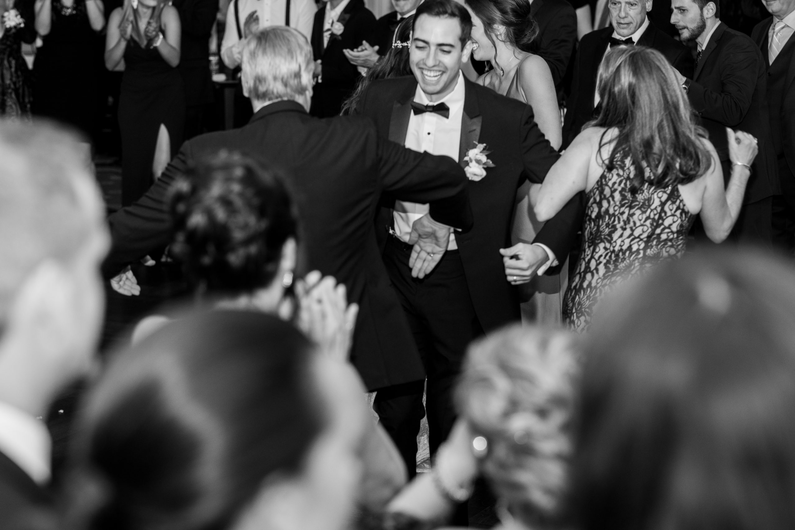 groom laughs during traditional italian dance