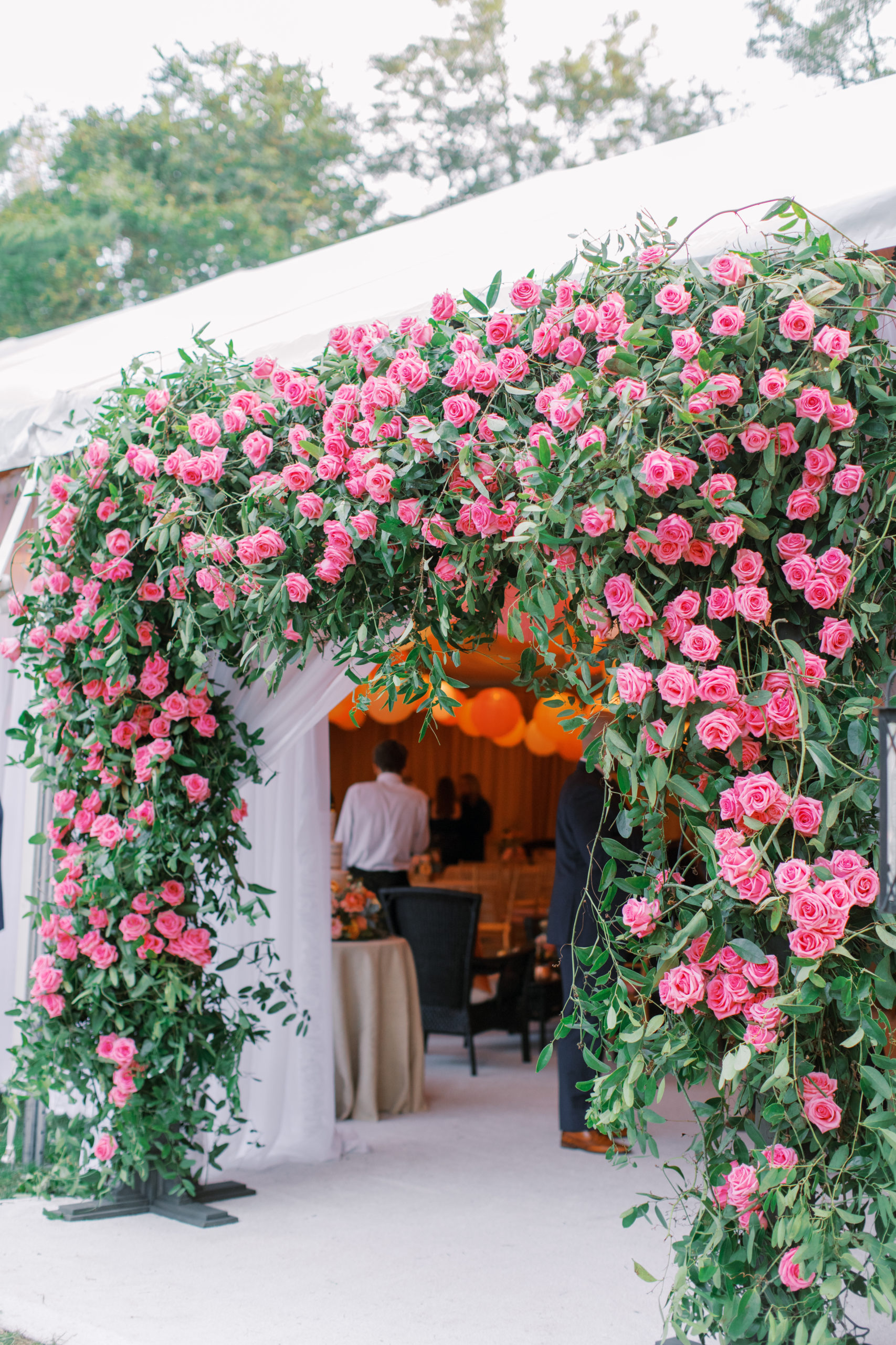 oversized rose covered square entrance to reception tent NJ Private Estate Wedding Photography