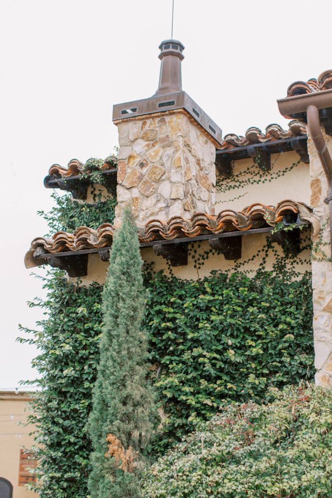 Tuscan style building with climbing ivy