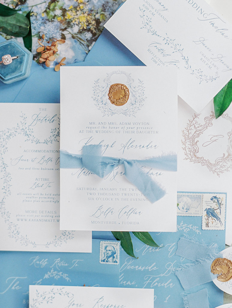 Luxury wedding invitation with blue envelopes and gold wax seal