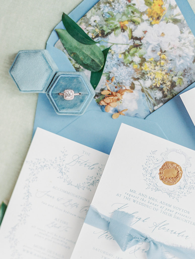 luxury wedding invitation suite with blue envelopes and blue ring box