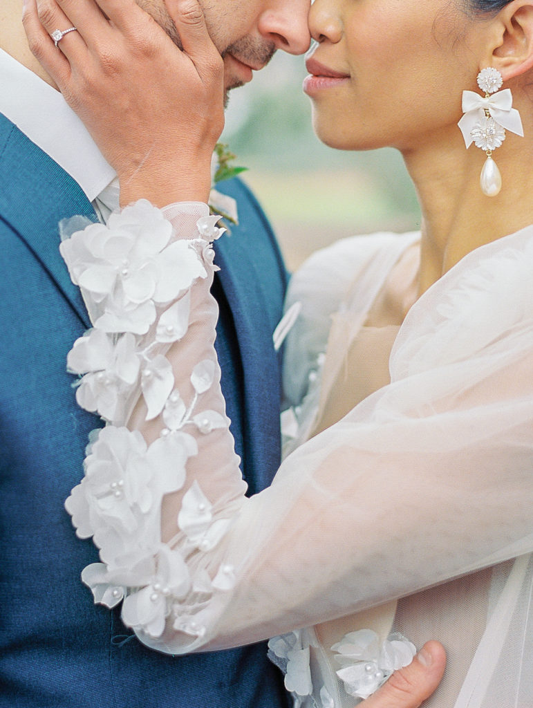 close up of bride and groom embracing Bella Collina Wedding Photography