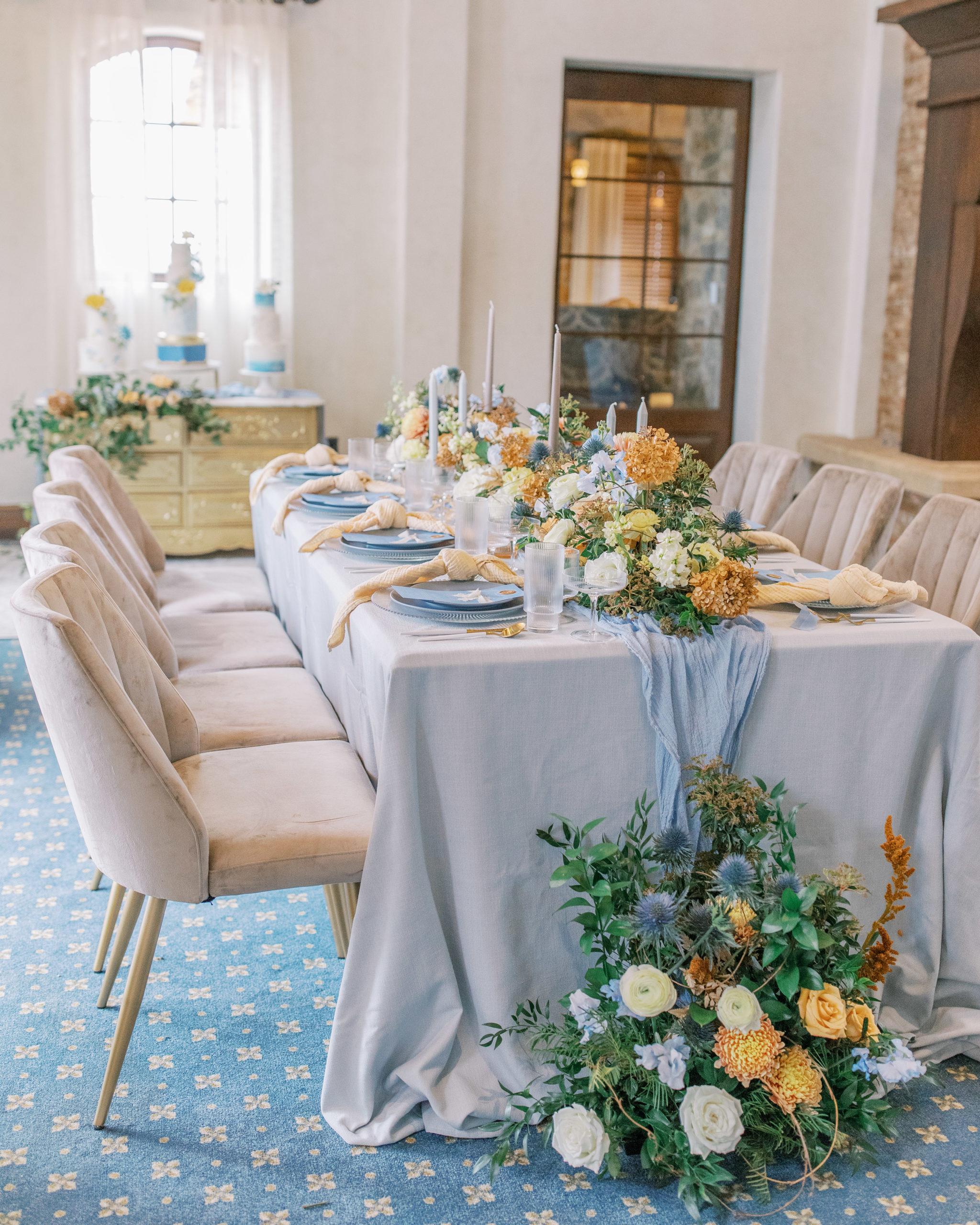 blue reception table with greenery and golden hydrangeas Bella Collina Wedding Photography