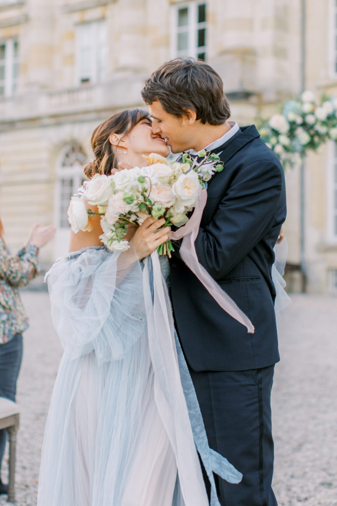 Bride and Groom Kiss at Chateau de Courtomer Wedding Ceremony