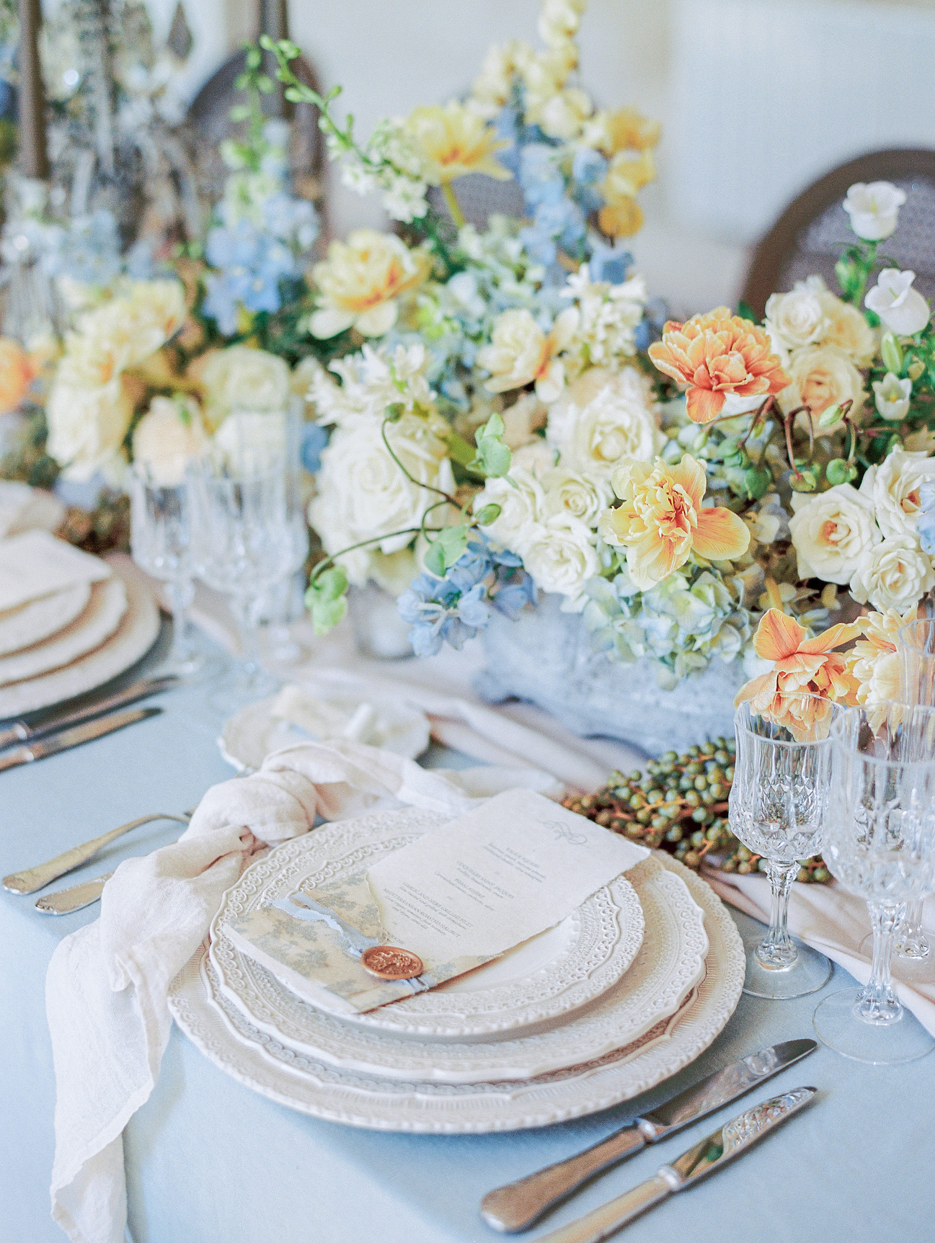 Reception table with tulips and garden roses and custom menus