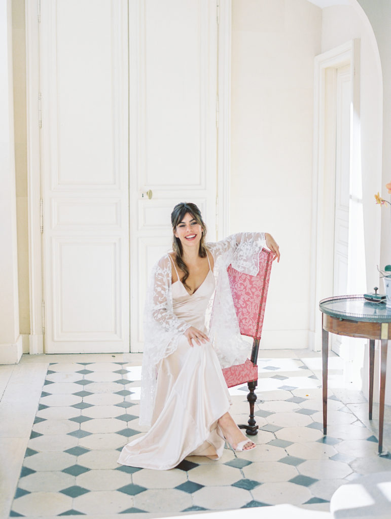 Bride laughs while getting ready for Chateau de Courtomer Wedding
