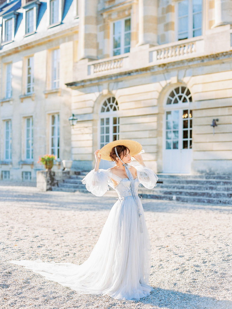 Bride in Floral Sun Hat at French Chateau Wedding