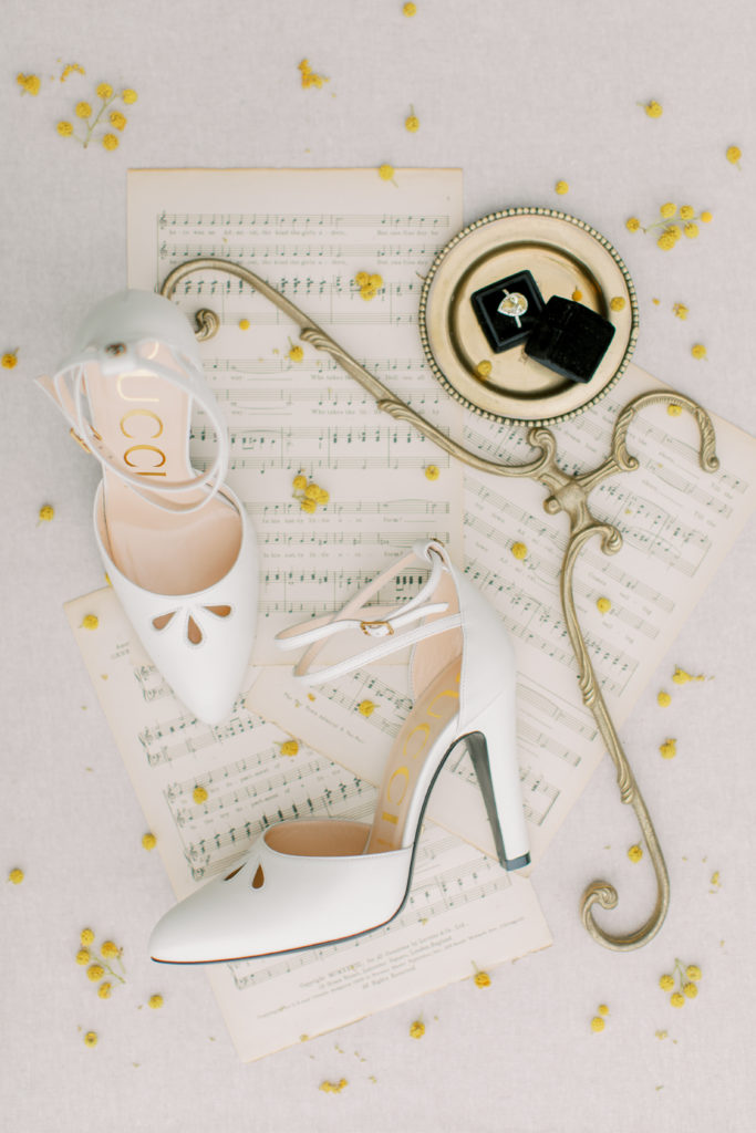 Shoes and diamond ring with small yellow flowers