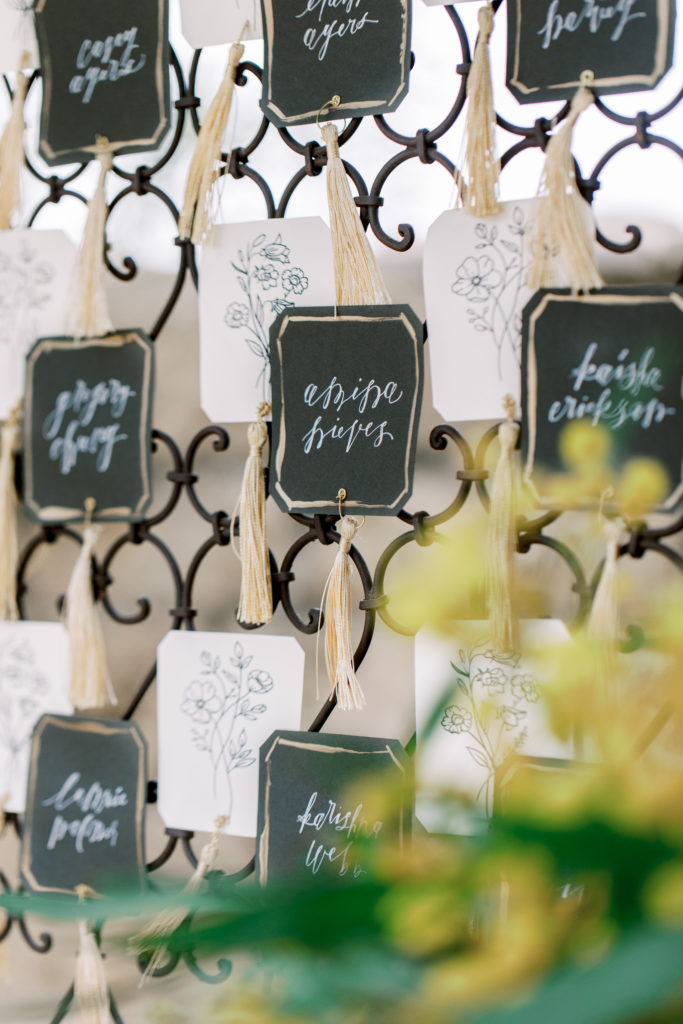 close up of escort card display among olive trees