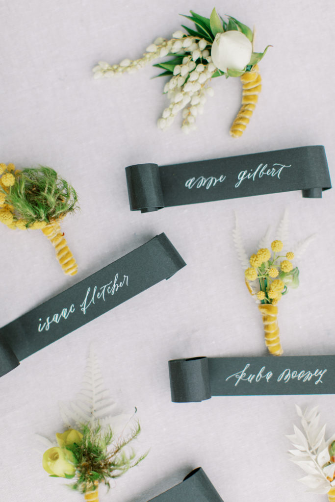 Boutonnieres with calligraphy name scrolls