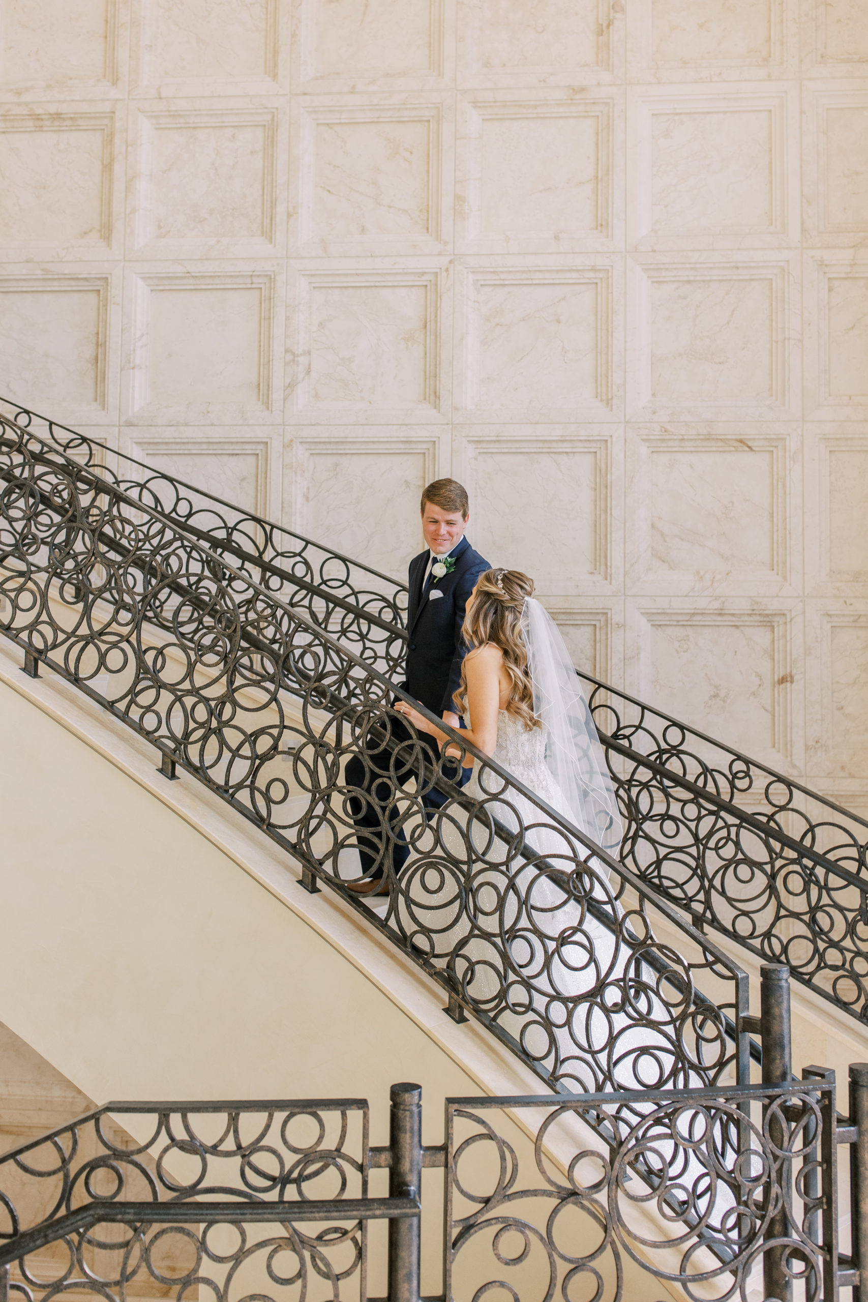 Bride and Groom climb stairs at Four Seasons Walt Disney World Wedding