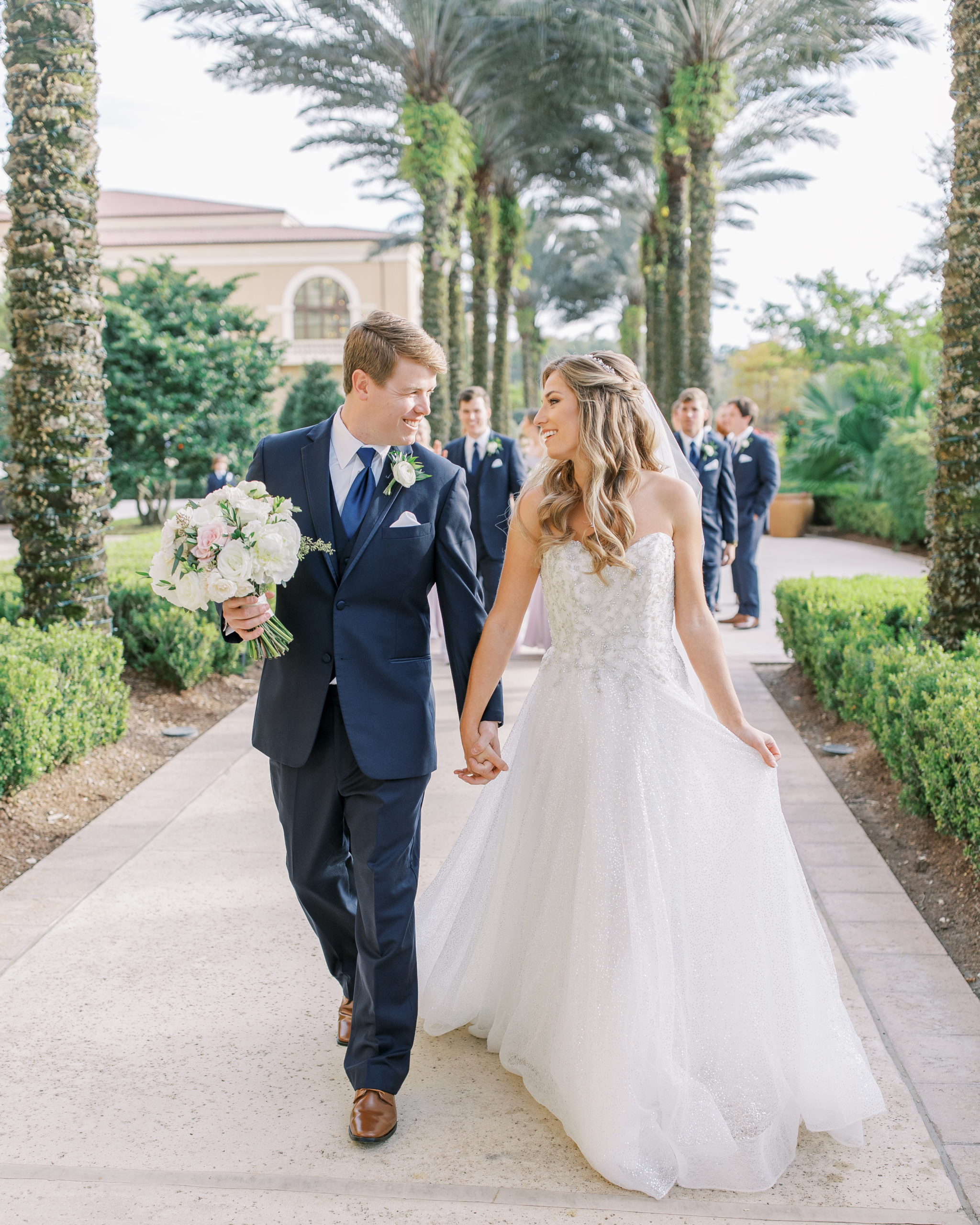 Bride and Groom walk together at Four Seasons Walt Disney World Wedding Photography