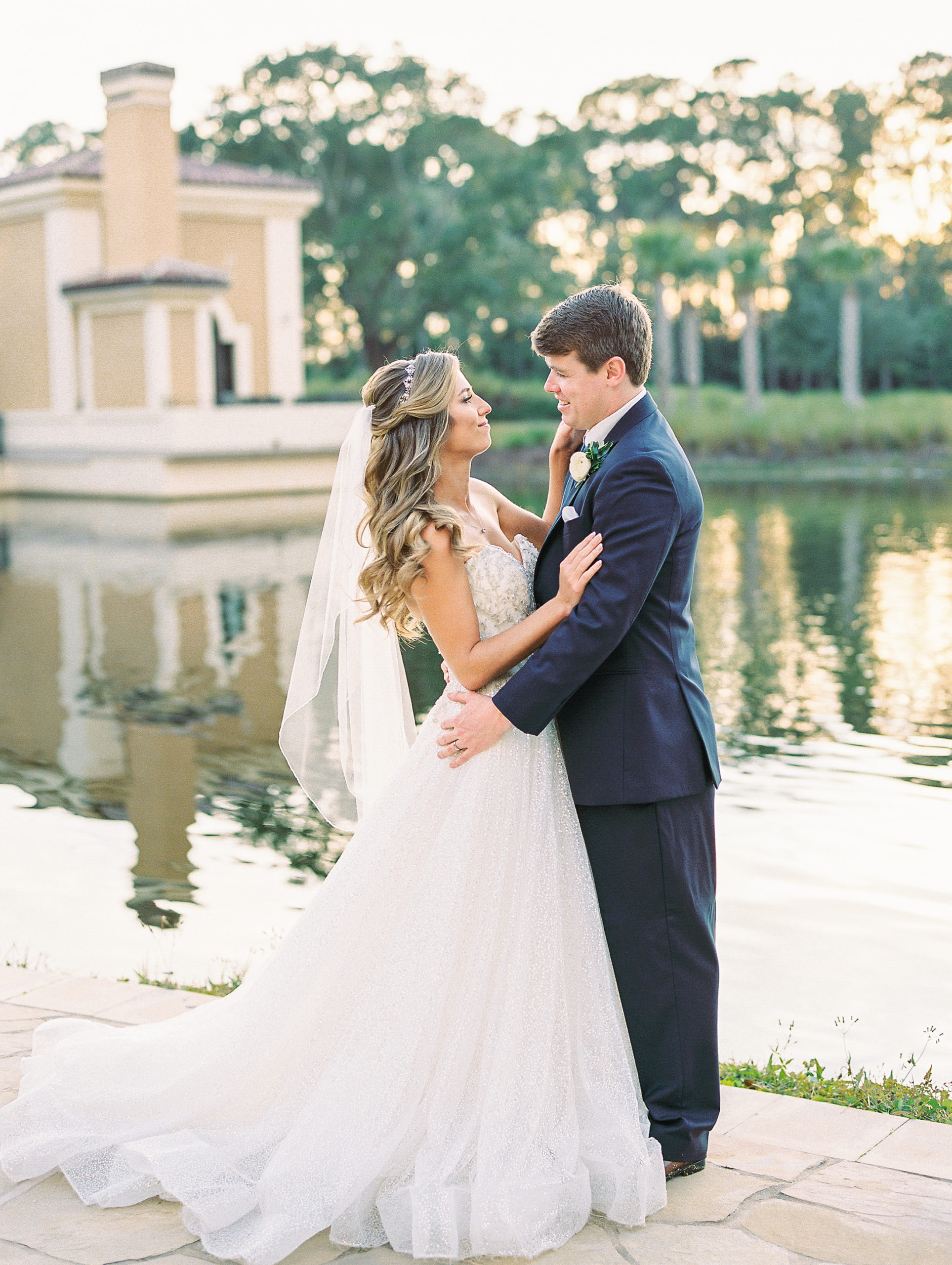 Bride and Groom smile at each other at Four Seasons Walt Disney World Wedding Photography