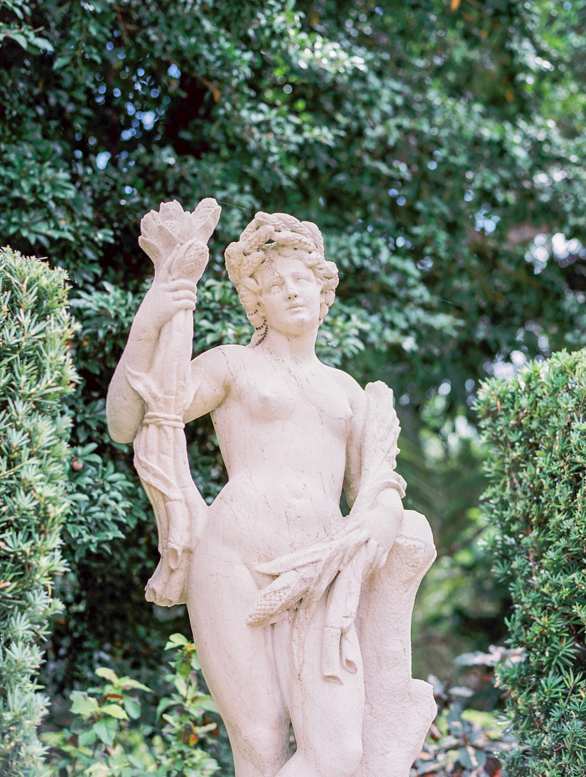 Statue at Vizcaya Museum surrounded by greenery