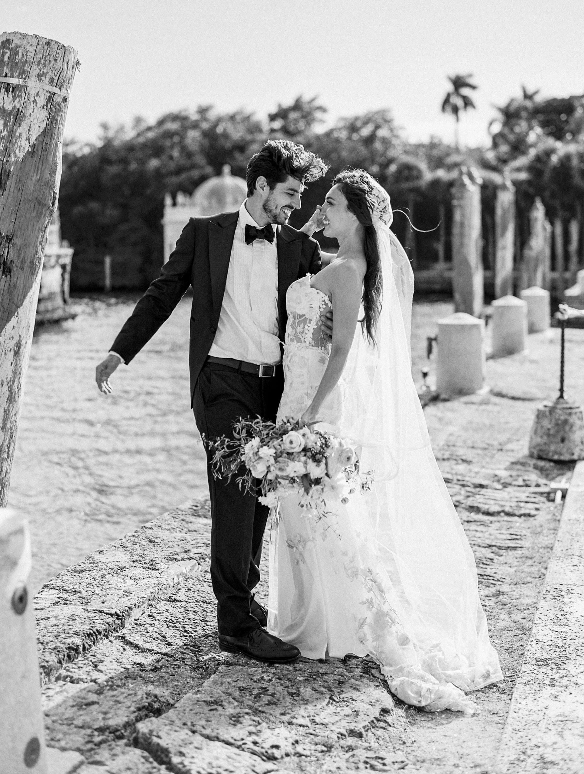 black and white portrait of bride and groom at vizcaya waterfront