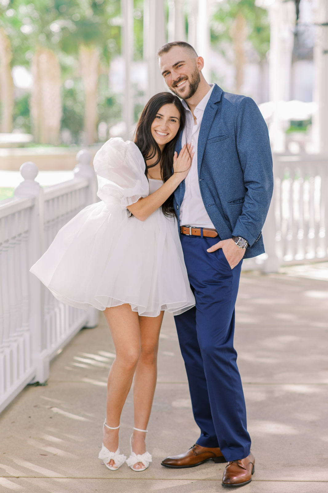 Disney Grand Floridian Engagement Session with groom in blue suit and bride in stylish selkie dress