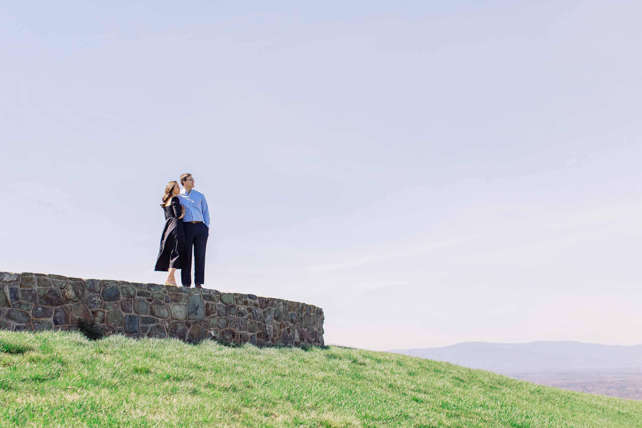 couple looks out over mountains at Spring at Montalto Engagement Session