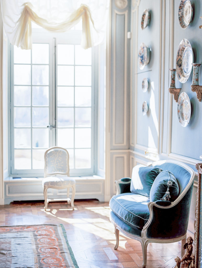 Sitting room with blue and white accents at Chateau de Villette Wedding Photography