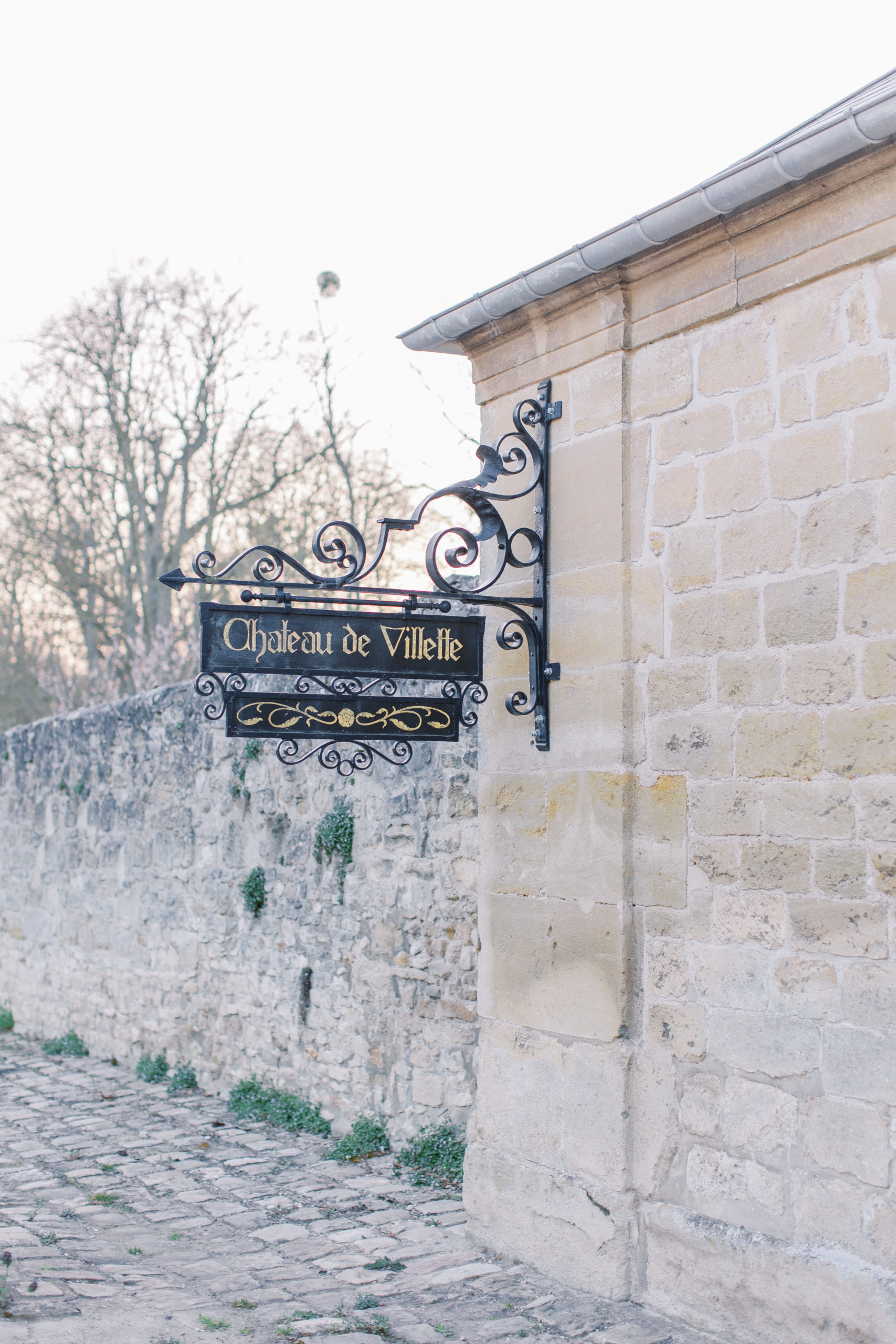Chateau de Villete Wedding entrance sign and stone walls