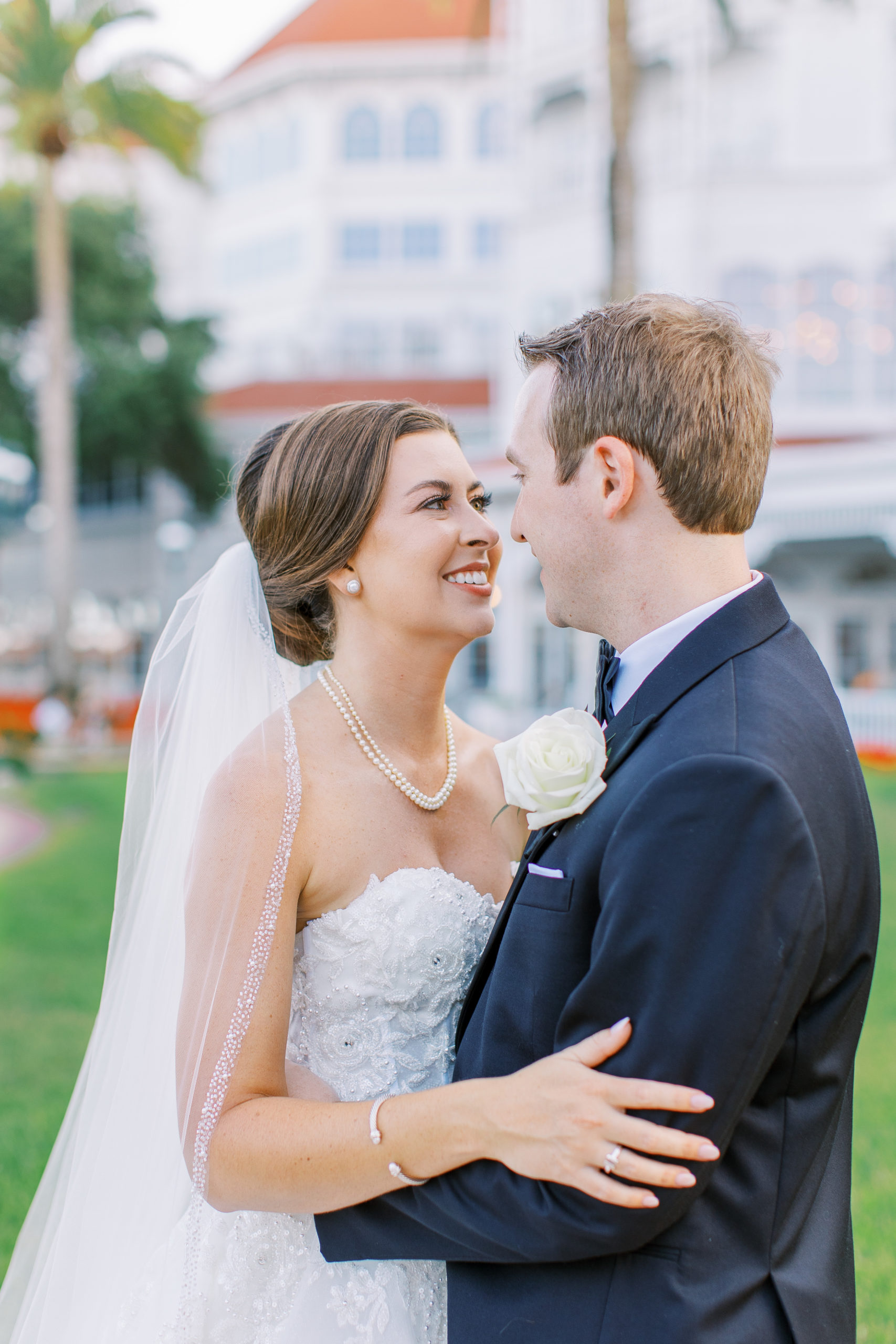 Bride and groom look into each other's eyes and embrace at a Romantic and Timeless Grand Floridian Wedding 