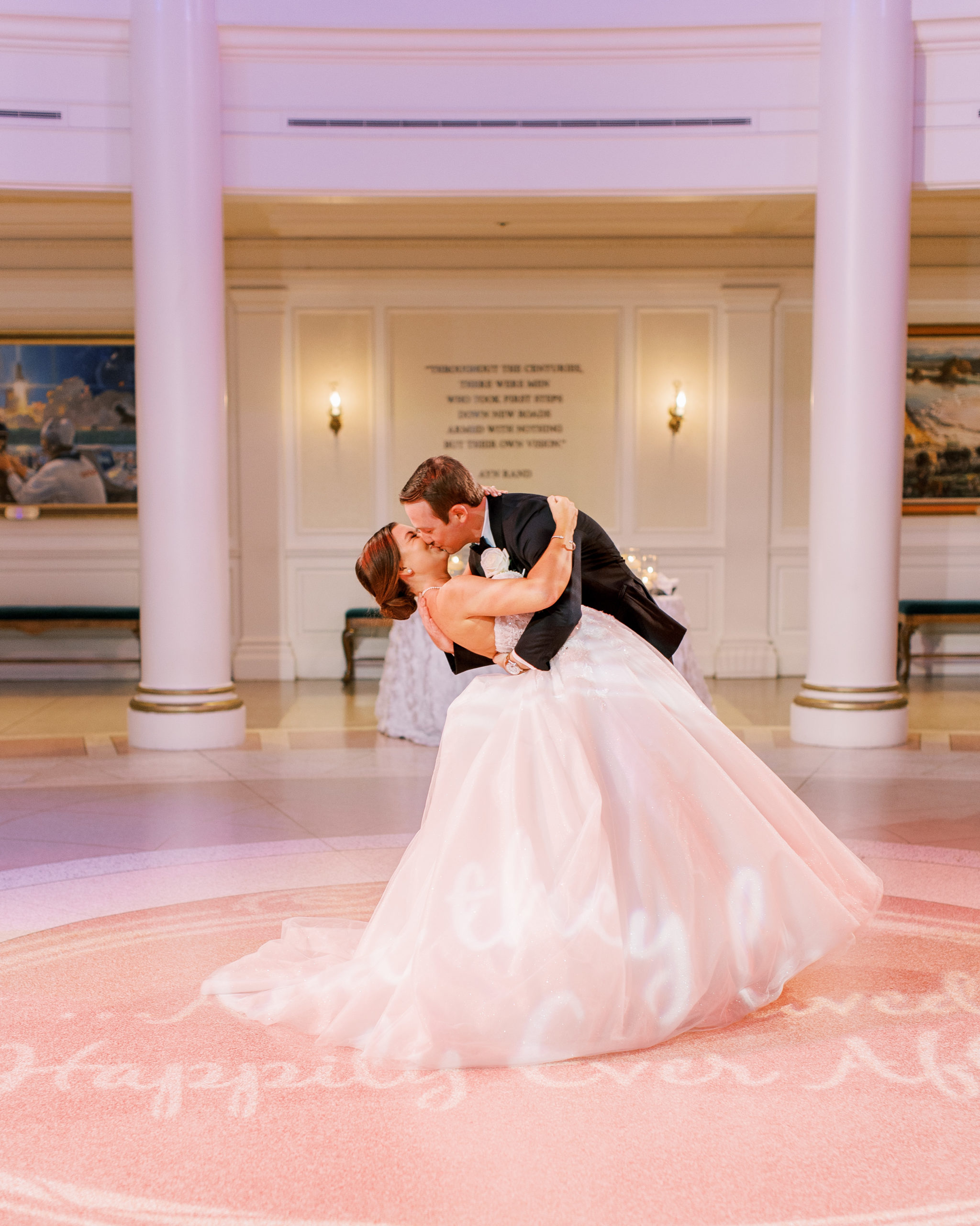 Bride and groom kiss on dance floor at wedding reception for a Romantic and Timeless Grand Floridian Wedding 
