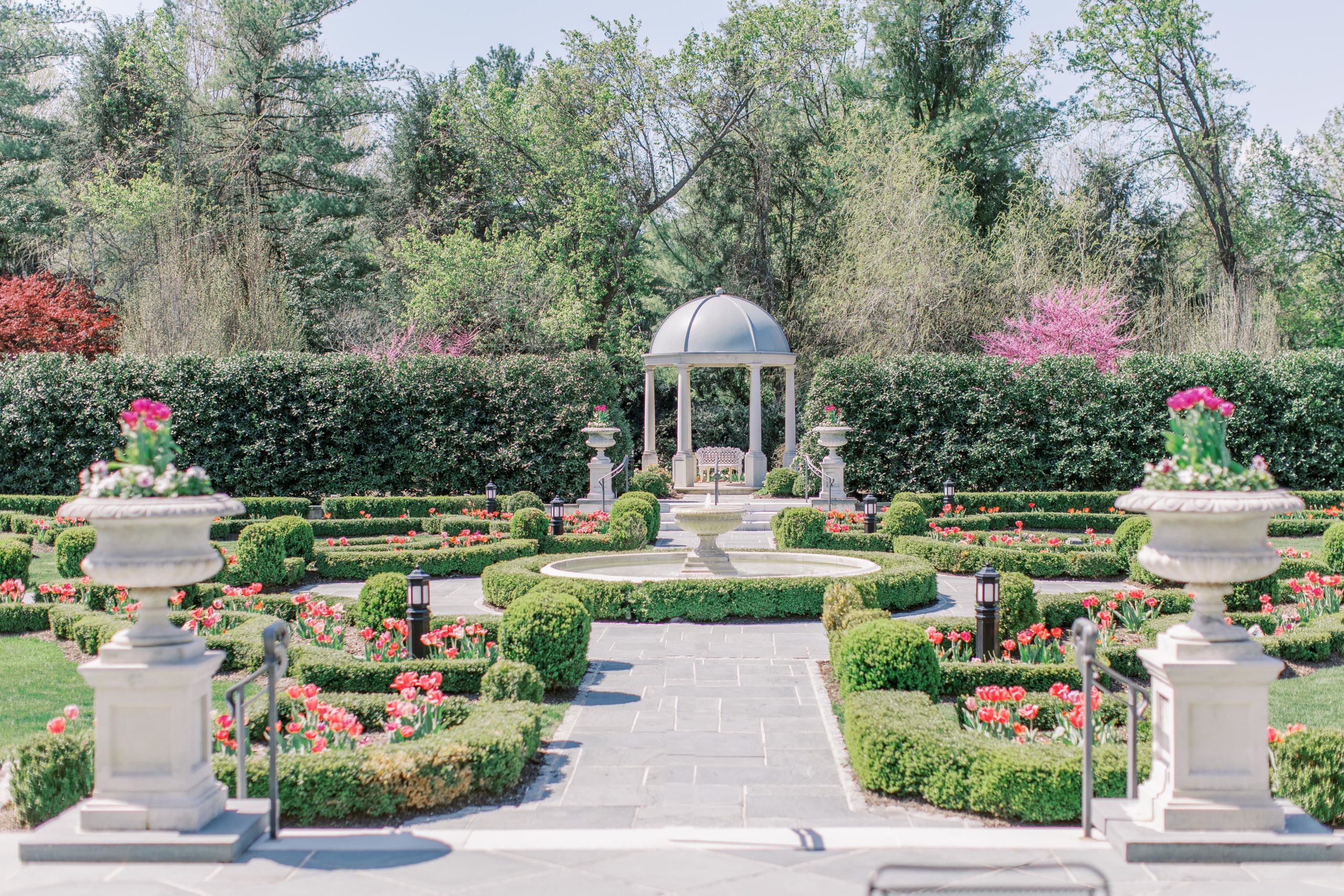 Chateau garden with pink and purple flowers at for a Romantic Park Chateau Wedding Photography