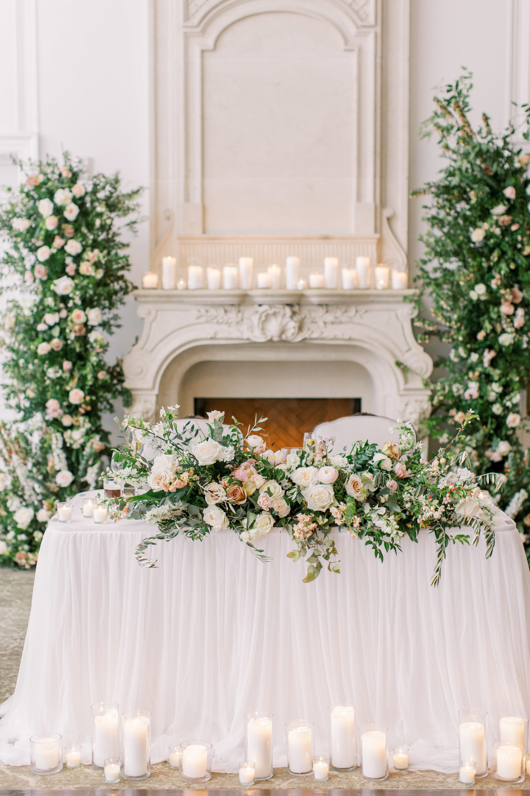Bride's table at wedding reception with white and peach roses for a Romantic Park Chateau Wedding Photography