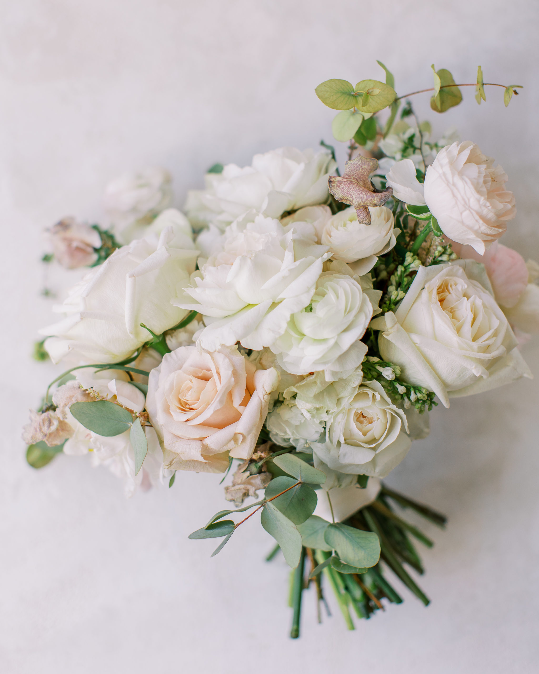 Wedding bouquet of peach and white roses 