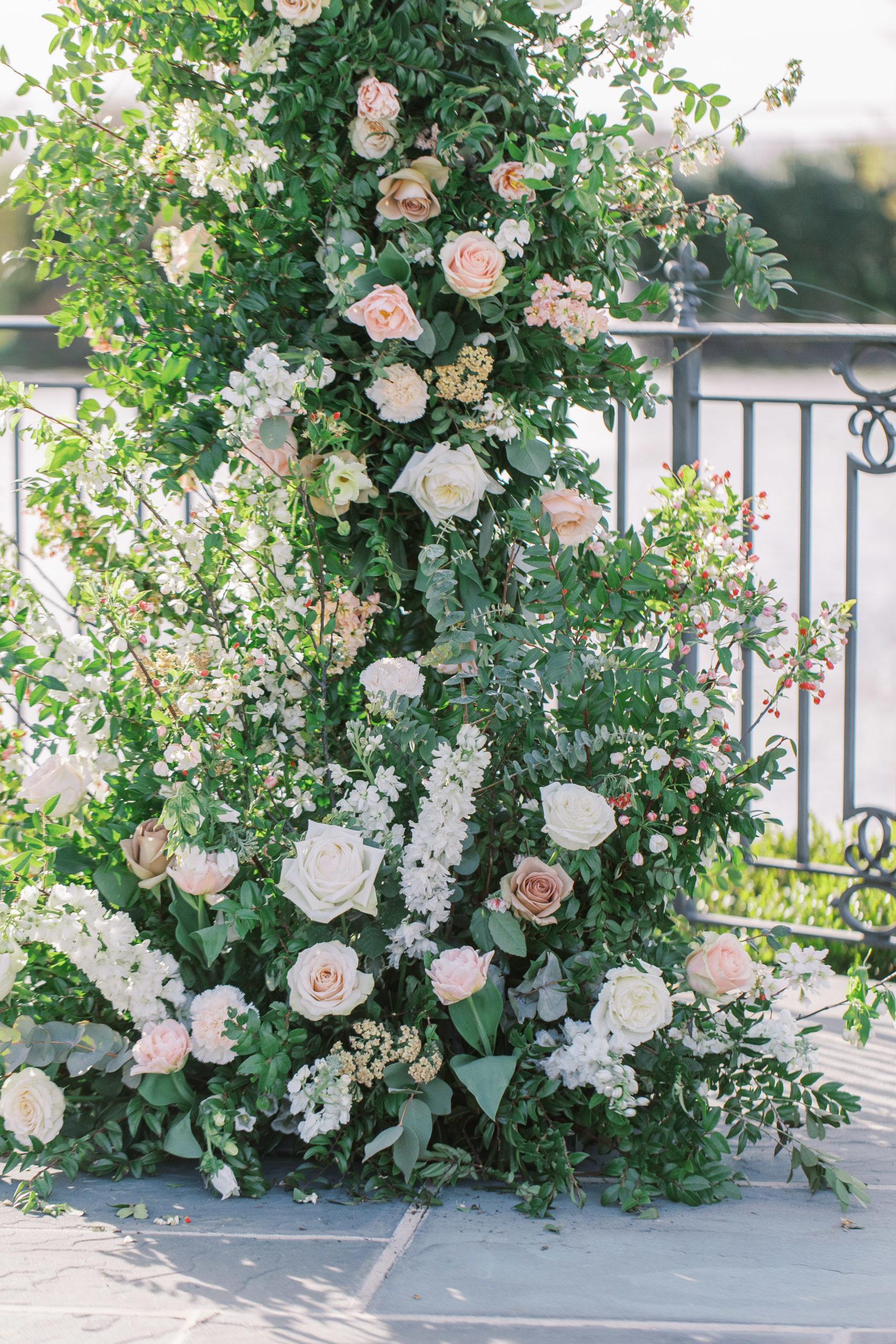White and peach rose arch for a Romantic Park Chateau Wedding Photography