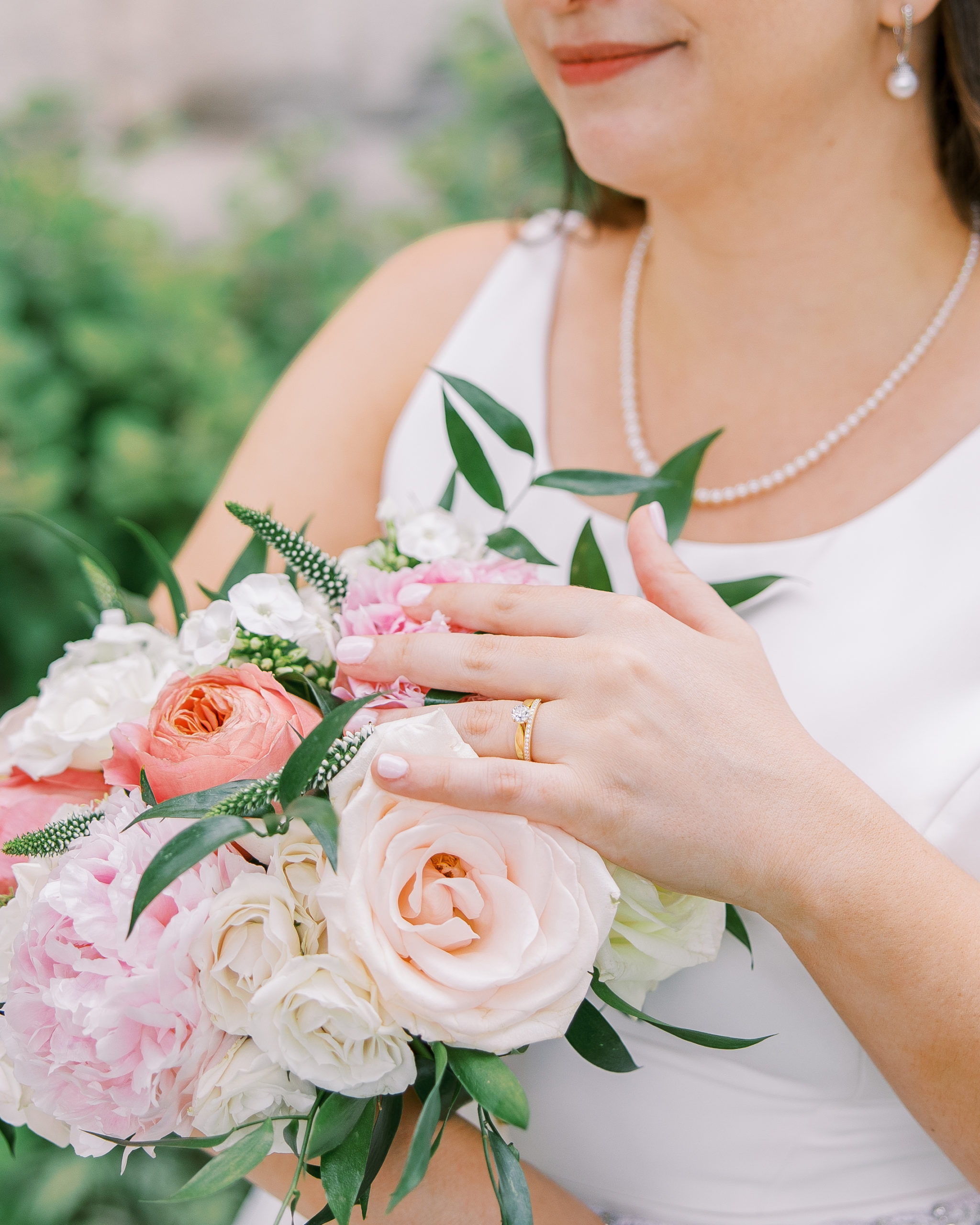 Bride holds pink and cream rose bouquet for Cairnwood Estate Wedding Photography