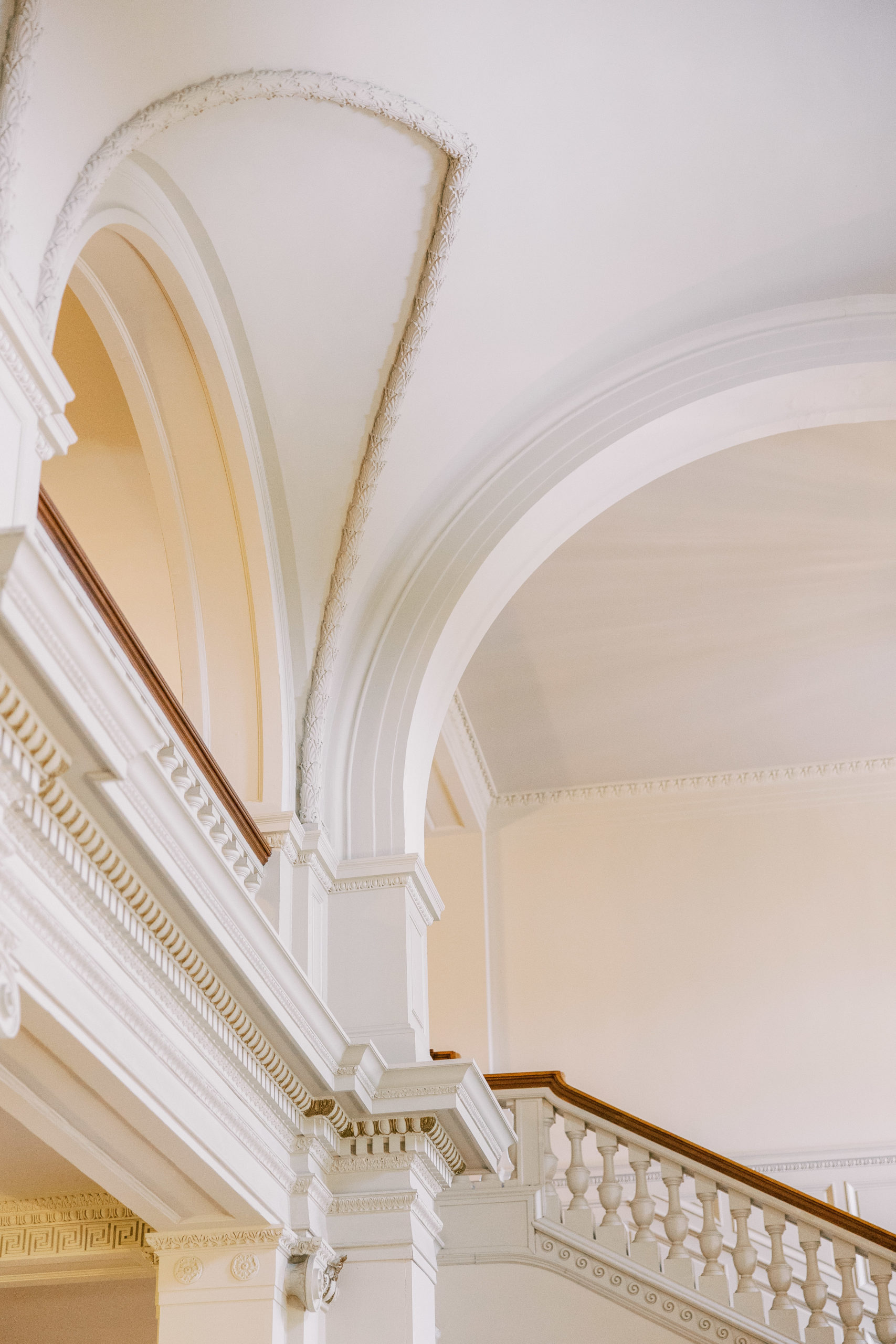 Barrel vaulted ceiling and staircase in the great hall of estate for Cairnwood Estate Wedding Photography