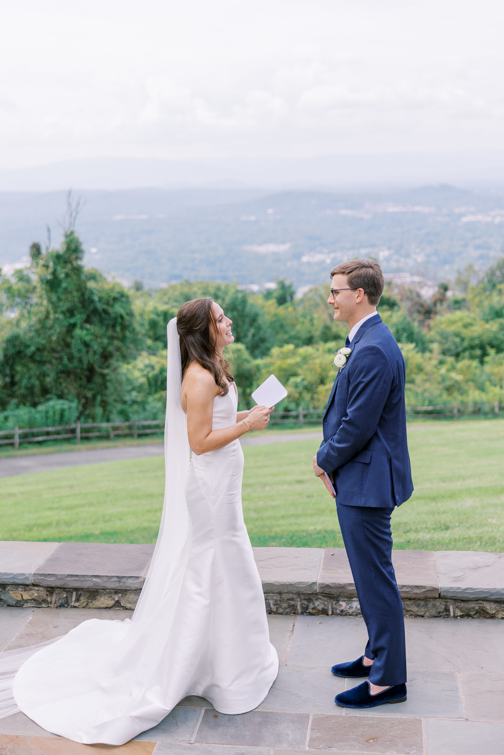Bride recites vows to groom outside atop mountainside for Charlottesville Wedding Photography
