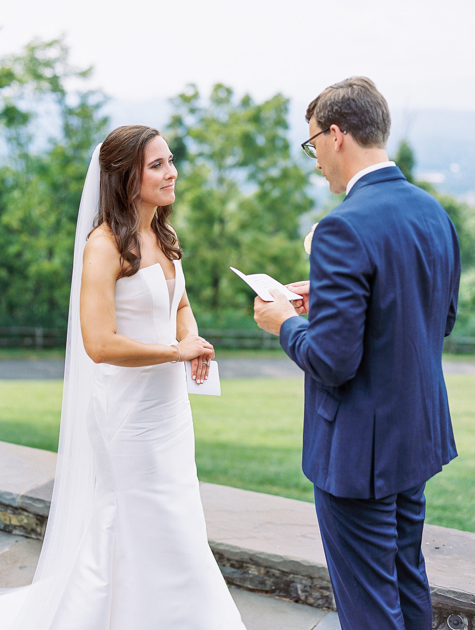 Groom reads bride his vows during their first look for Charlottesville Wedding Photography
