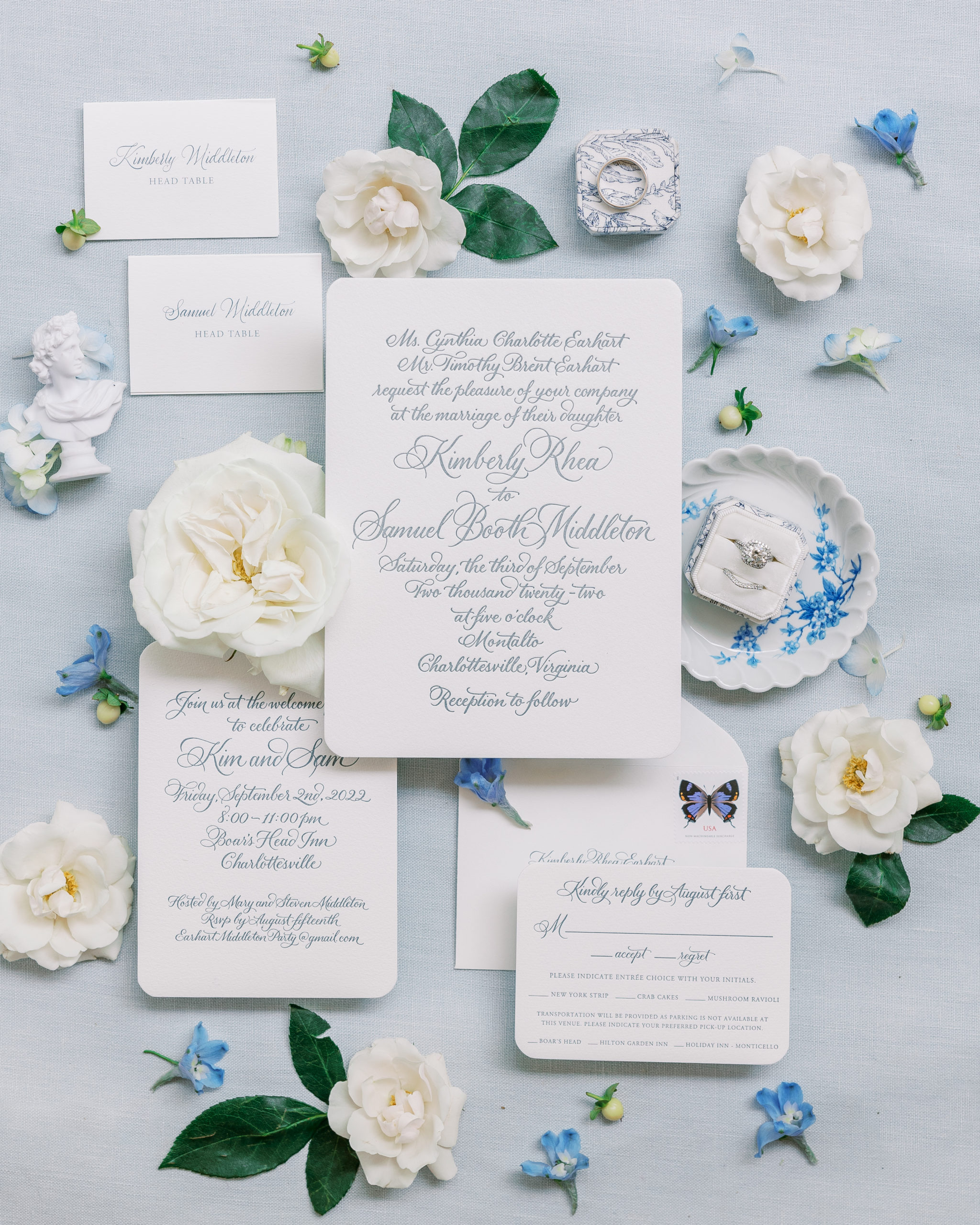 Cream and blue invitation suite with rings and white and blue flowers for Charlottesville Wedding Photography
