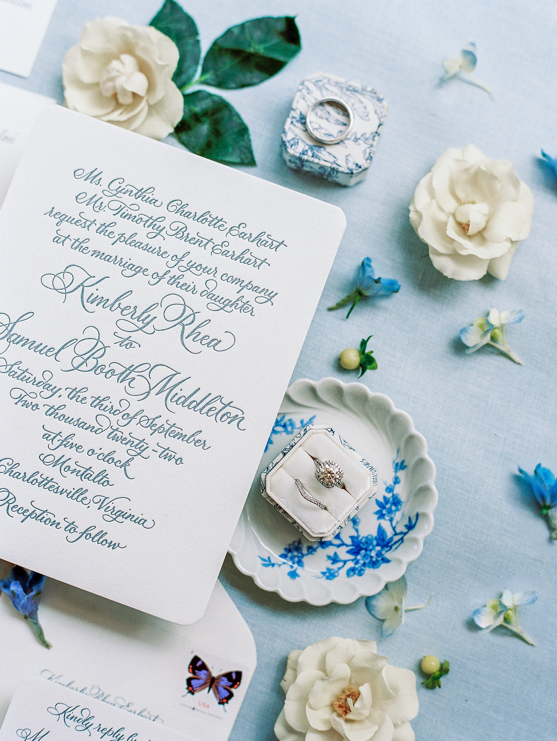 Delicate calligraphy invitations with rings, and white and blue accents for Charlottesville Wedding Photography