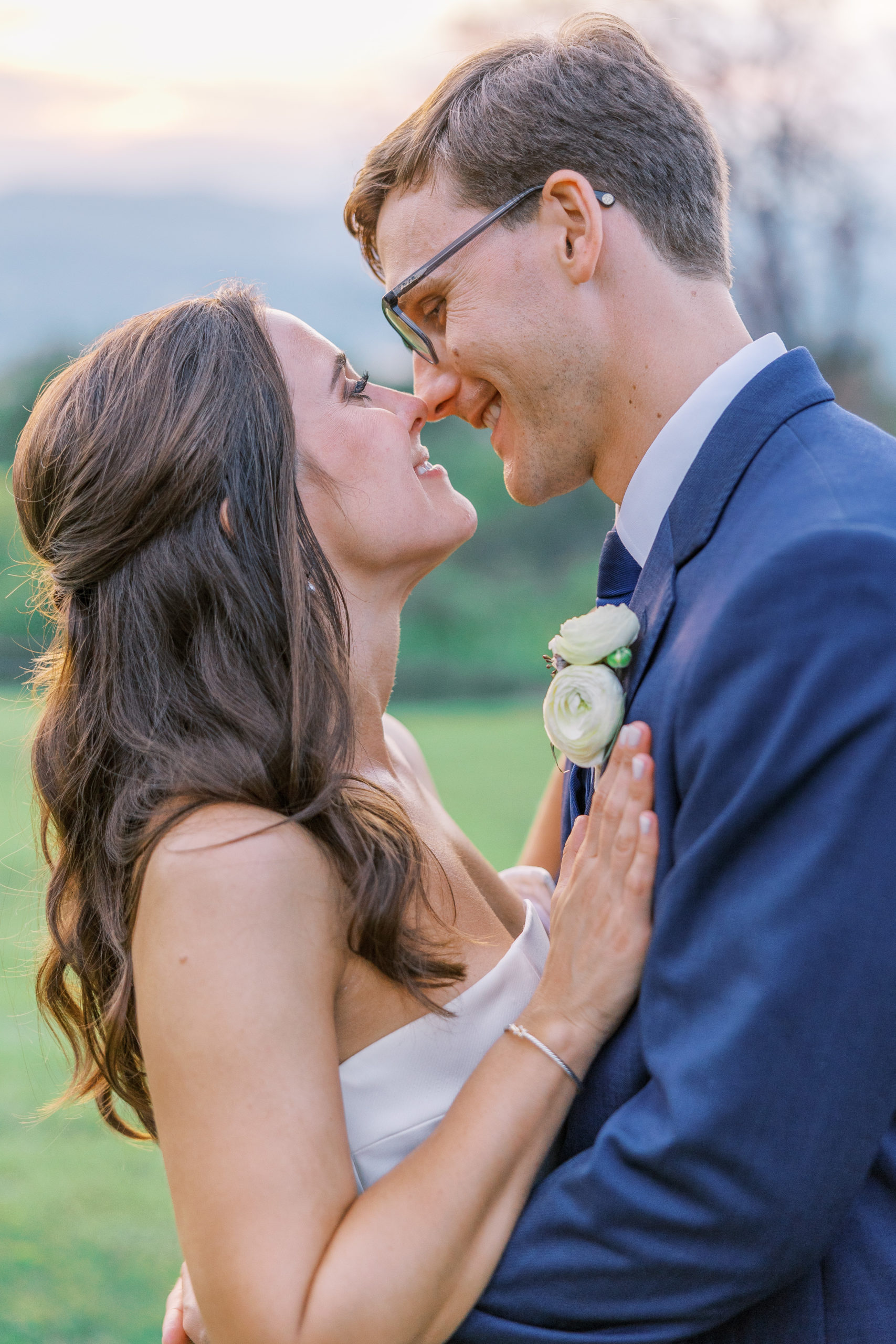 Bride and groom smile and lean in for a kiss for Charlottesville Wedding Photography
