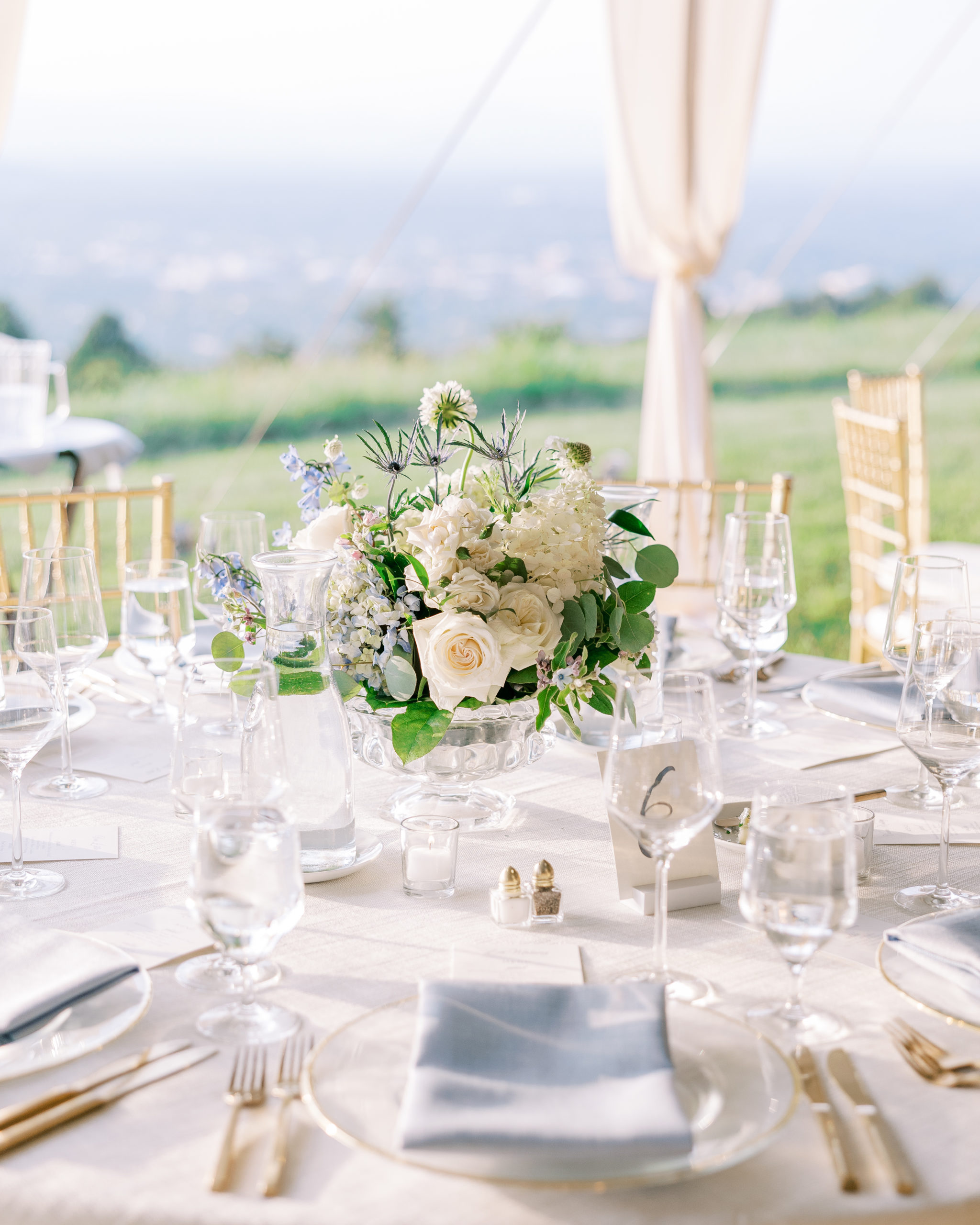 Wedding reception round white table with gold utensils and flower bouquet for Charlottesville Wedding Photography
