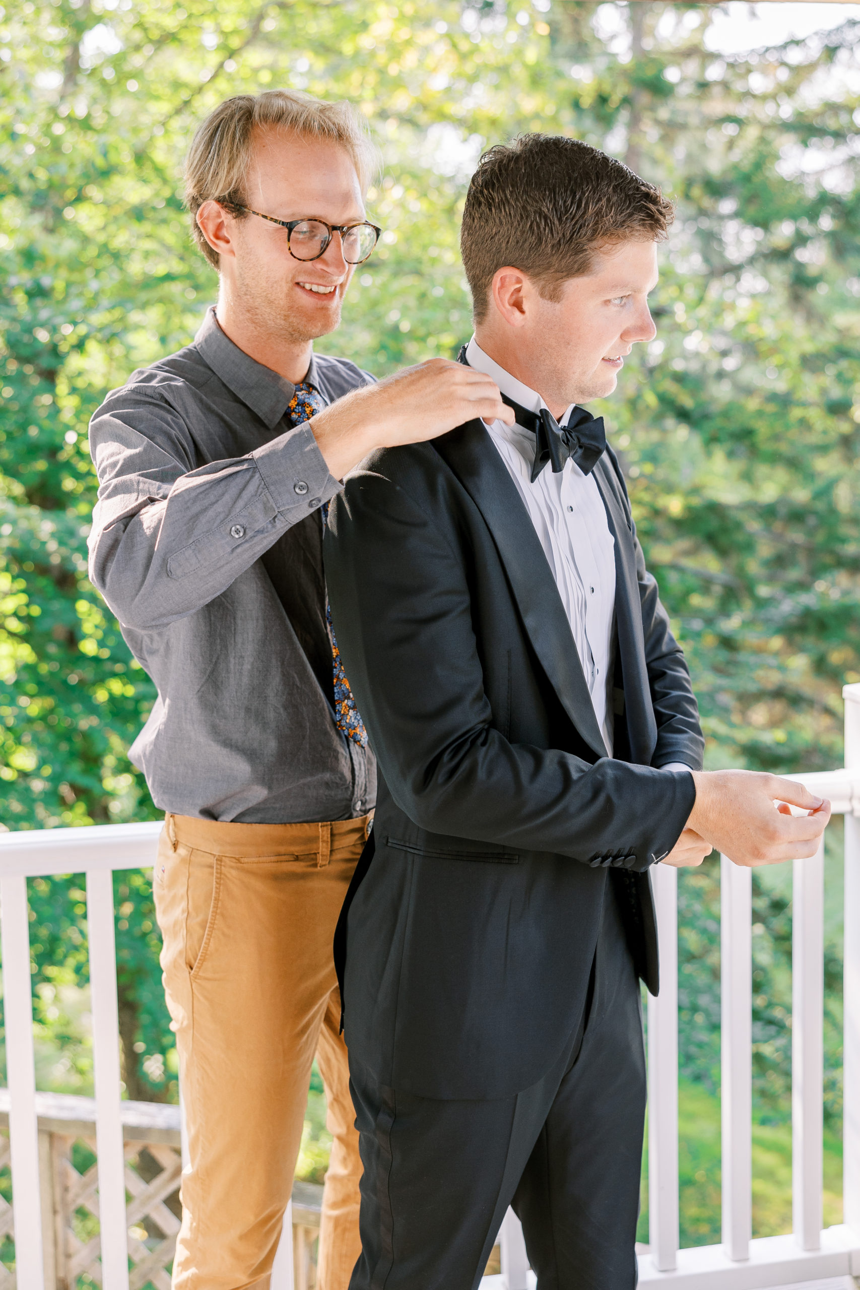 Groom has help adjusting bowtie for New Hampshire Wedding Photography