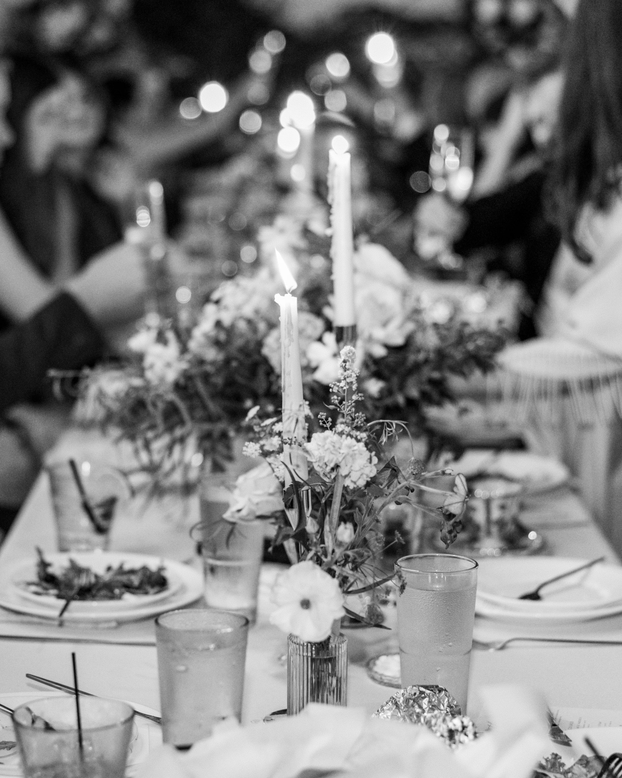 Reception dinner with candles illuminated in black and white for New Hampshire Wedding Photography