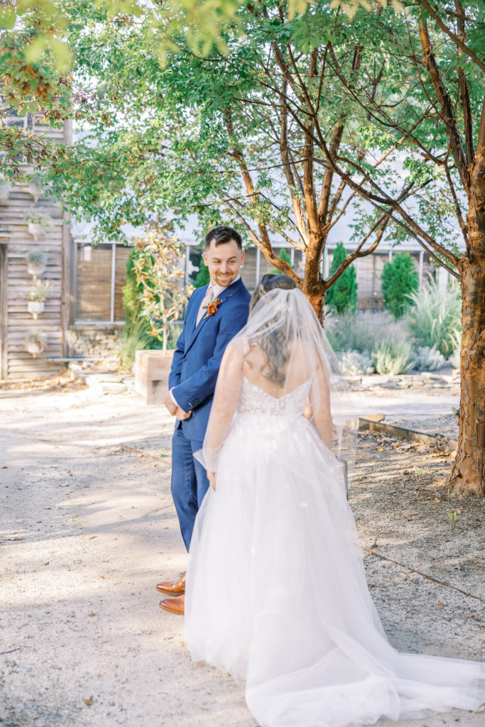 Bride and groom share a first look for Terrain Glen Mills Wedding