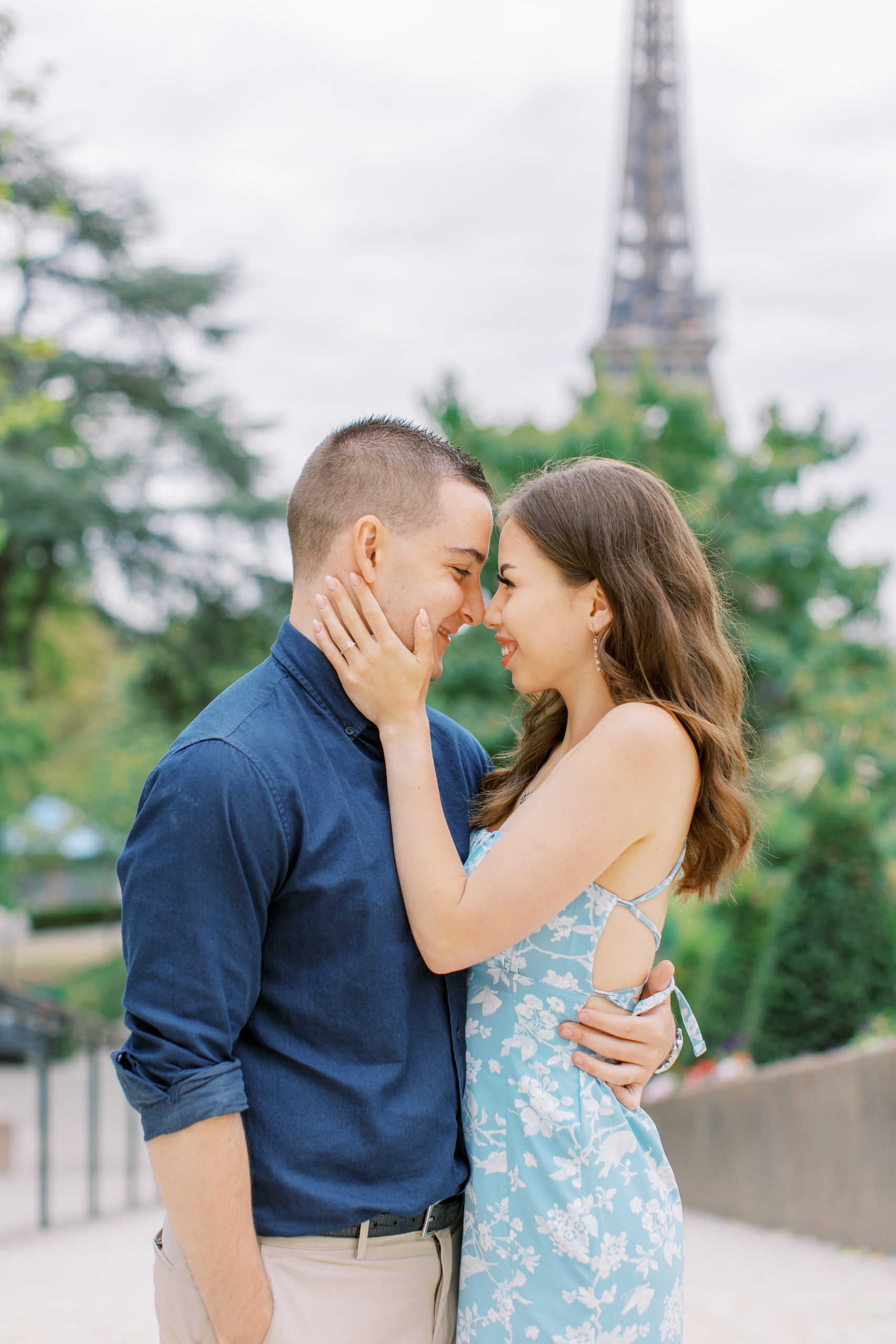 Couple embrace and smile with noses touching for Paris Engagement Session