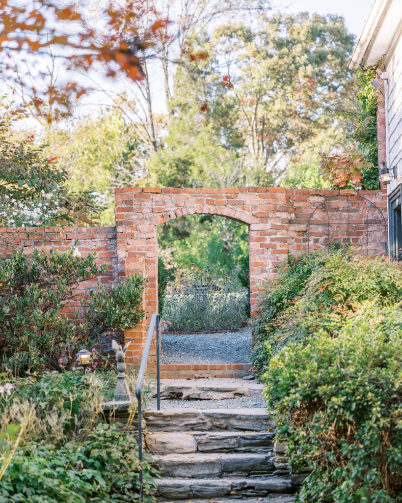 Brick arch entrance outdoors with stone stairs leading up to them for Clifton wedding photography