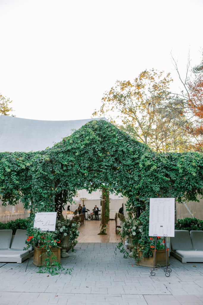 Entrance to wedding reception of signs and greenery on white tent for Clifton wedding photography 