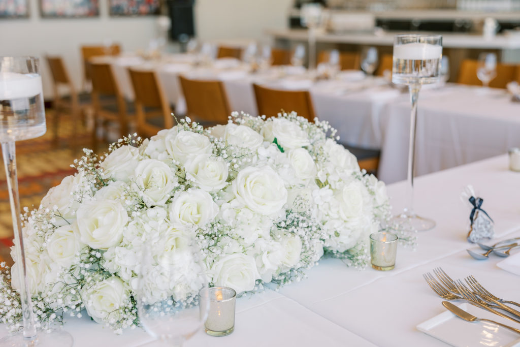 Wedding reception table white rose centerpiece arrangement 