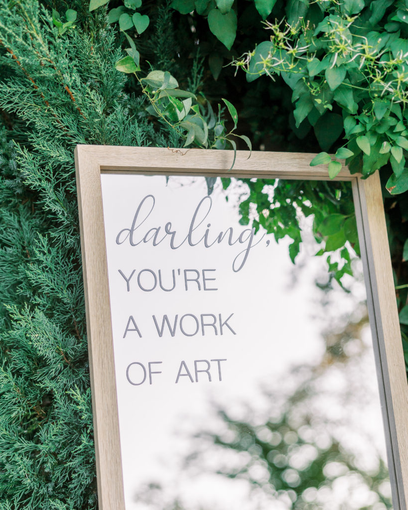 "darling you're a work of art" written on mirror at entrance of wedding for philadelphia wedding photographer