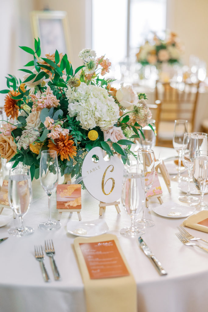 Table 6 wedding reception with white and orange flower center piece for philadelphia wedding photographer