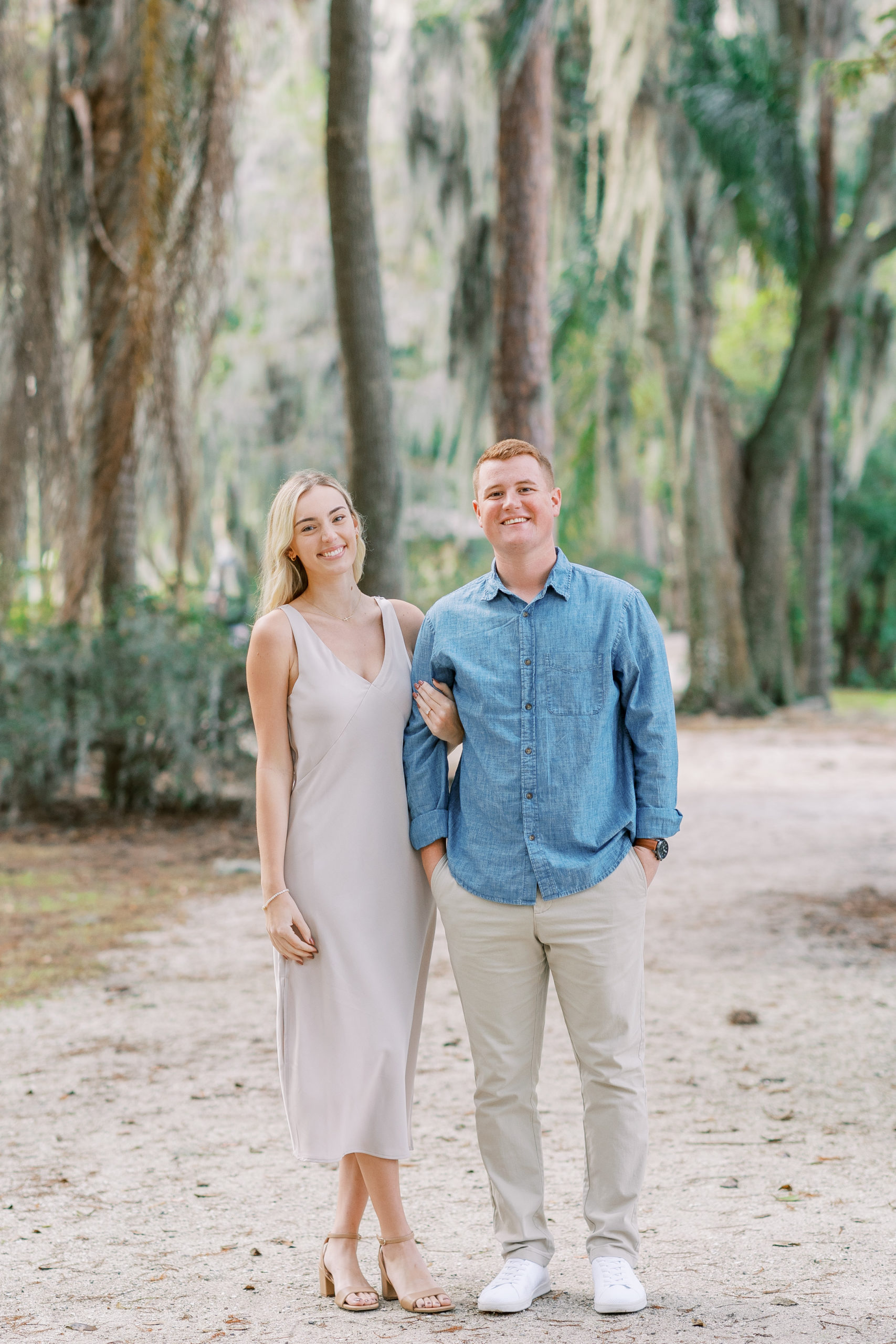 couple smiles happily in posed portrait