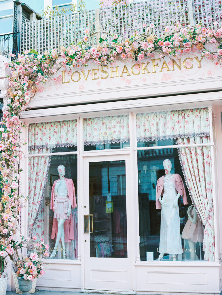 Pink storefront in london at LoveShack Fancy store covered in pink flowers